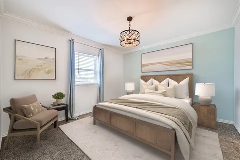 a bedroom with bed and a window