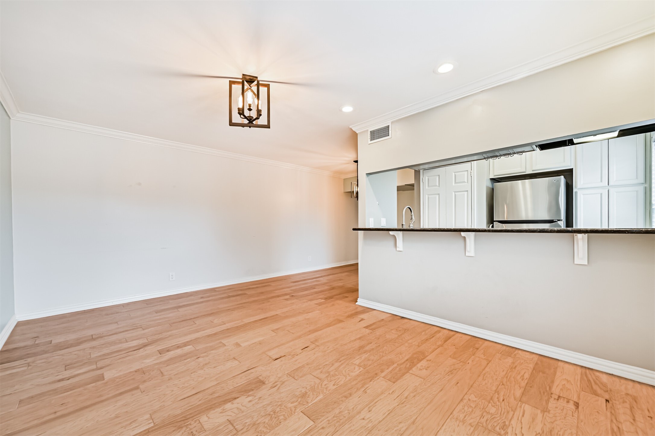 402 Postoffice Street, Unit 201 Galveston, TX 77550 - Photo 6 of 29 a view of empty room with wooden floor