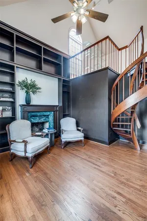 a bedroom with furniture and a fireplace