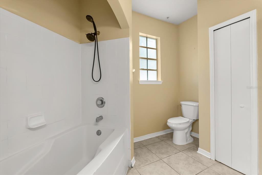126 Vista Verdi Circle, Unit 108 Lake Mary, FL 32746 - Photo 15 of 20 a bathroom with a toilet sink and shower