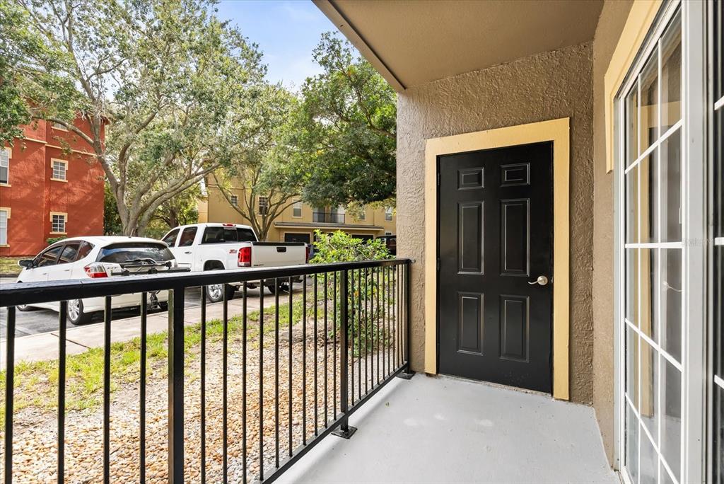 126 Vista Verdi Circle, Unit 108 Lake Mary, FL 32746 - Photo 18 of 20 a front view of a house with a glass door