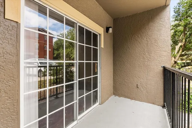 an aerial view of a house with a lake view