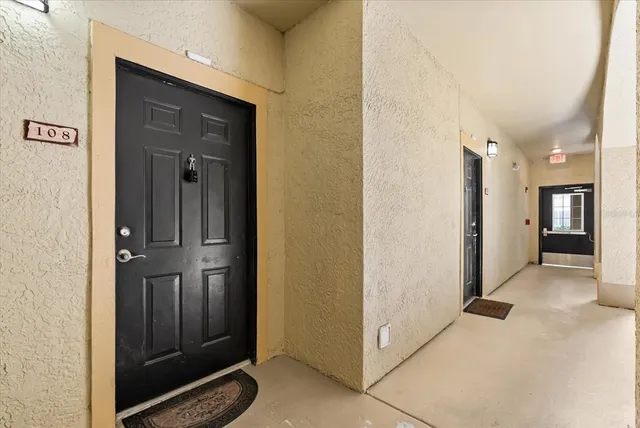 a view of a hallway with wooden shelves