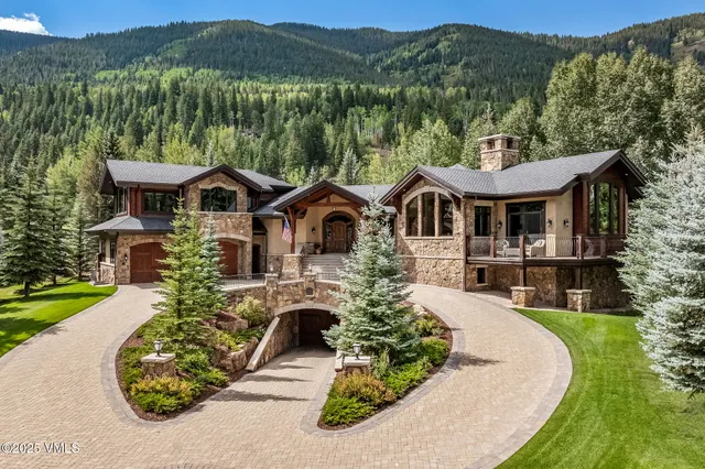 a front view of a house with a yard table and chairs
