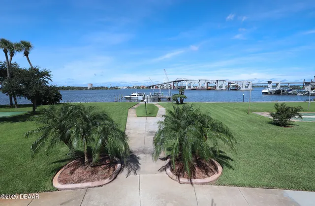 a view of a swimming pool with a yard