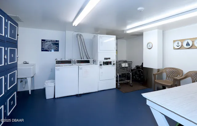 a view of a workspace with furniture and a bookshelf