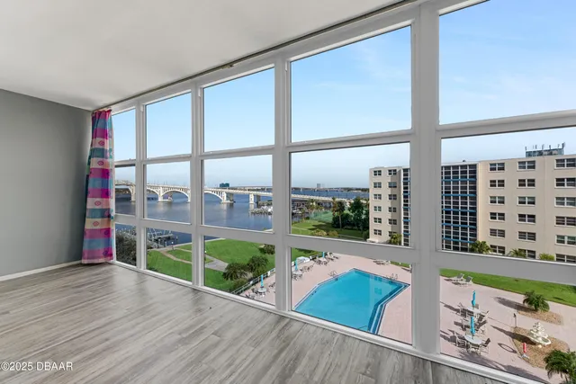 wooden floor in a room next to a window
