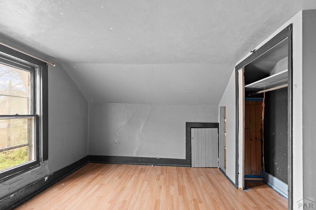 405 7th Street Fowler, CO 81039 - Photo 17 of 25 wooden floor in an empty room with a window