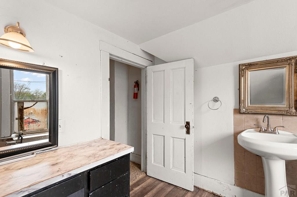 405 7th Street Fowler, CO 81039 - Photo 19 of 25 a bathroom with a sink and a mirror