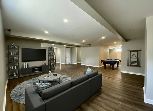 an empty room with wooden floor and closet