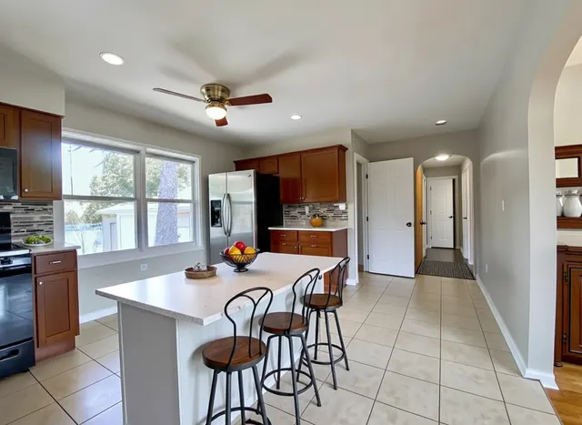 a view of a dining room with furniture window and outside view