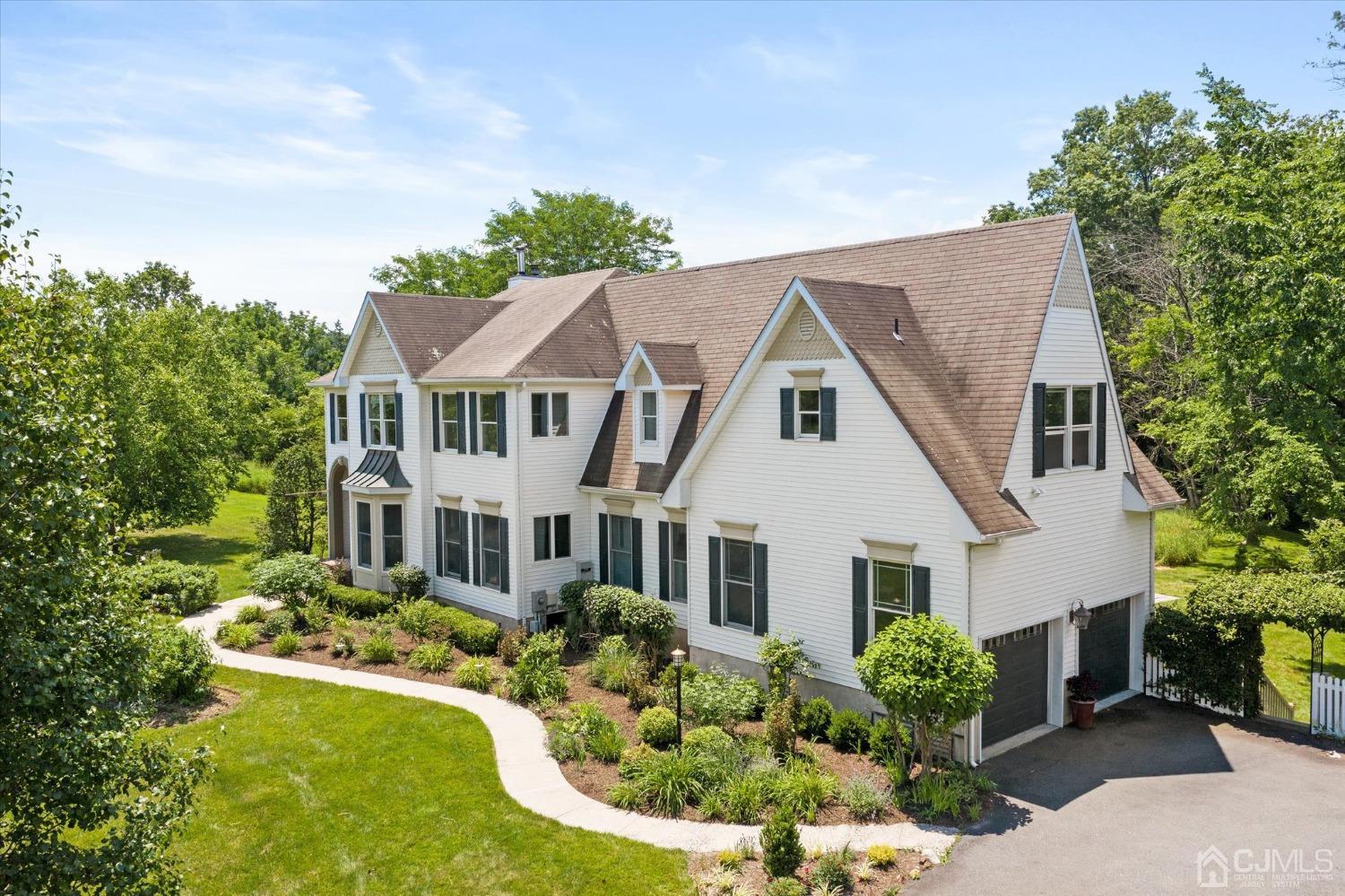 2 Old Mill Road Pennington, NJ 08534 - Photo 2 of 45 a aerial view of a white house with a yard and potted plants