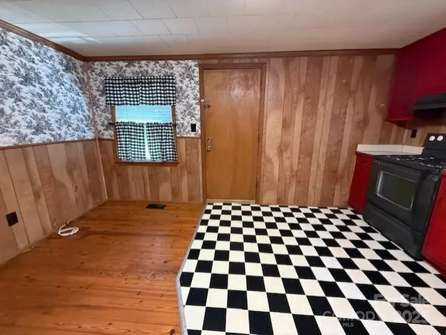 a bedroom with a black and white checkered floor