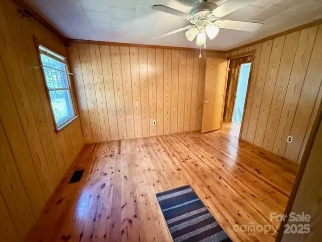 a view of an entryway with wooden floor