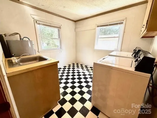 a room with a window and washer