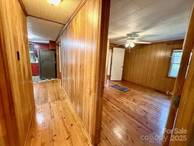 a view of a entryway door with wooden floor