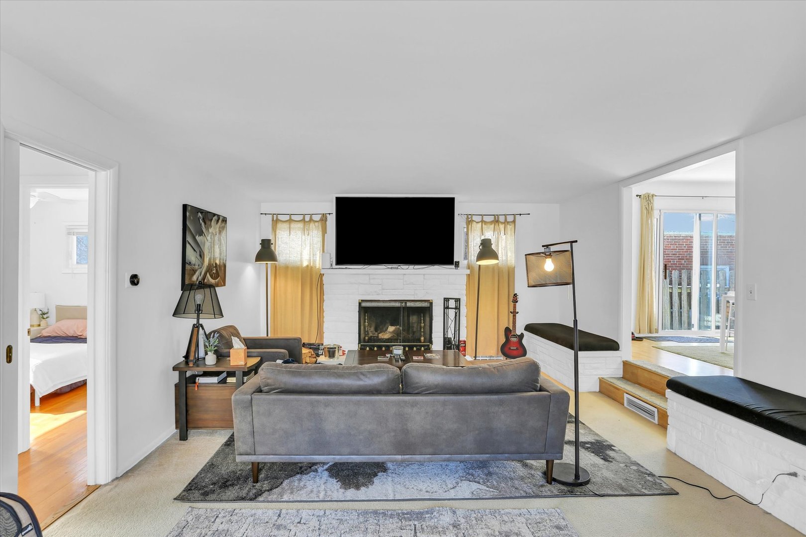 913 West Union Street Champaign, IL 61821 - Photo 14 of 32 a living room with furniture a fireplace and a flat screen tv