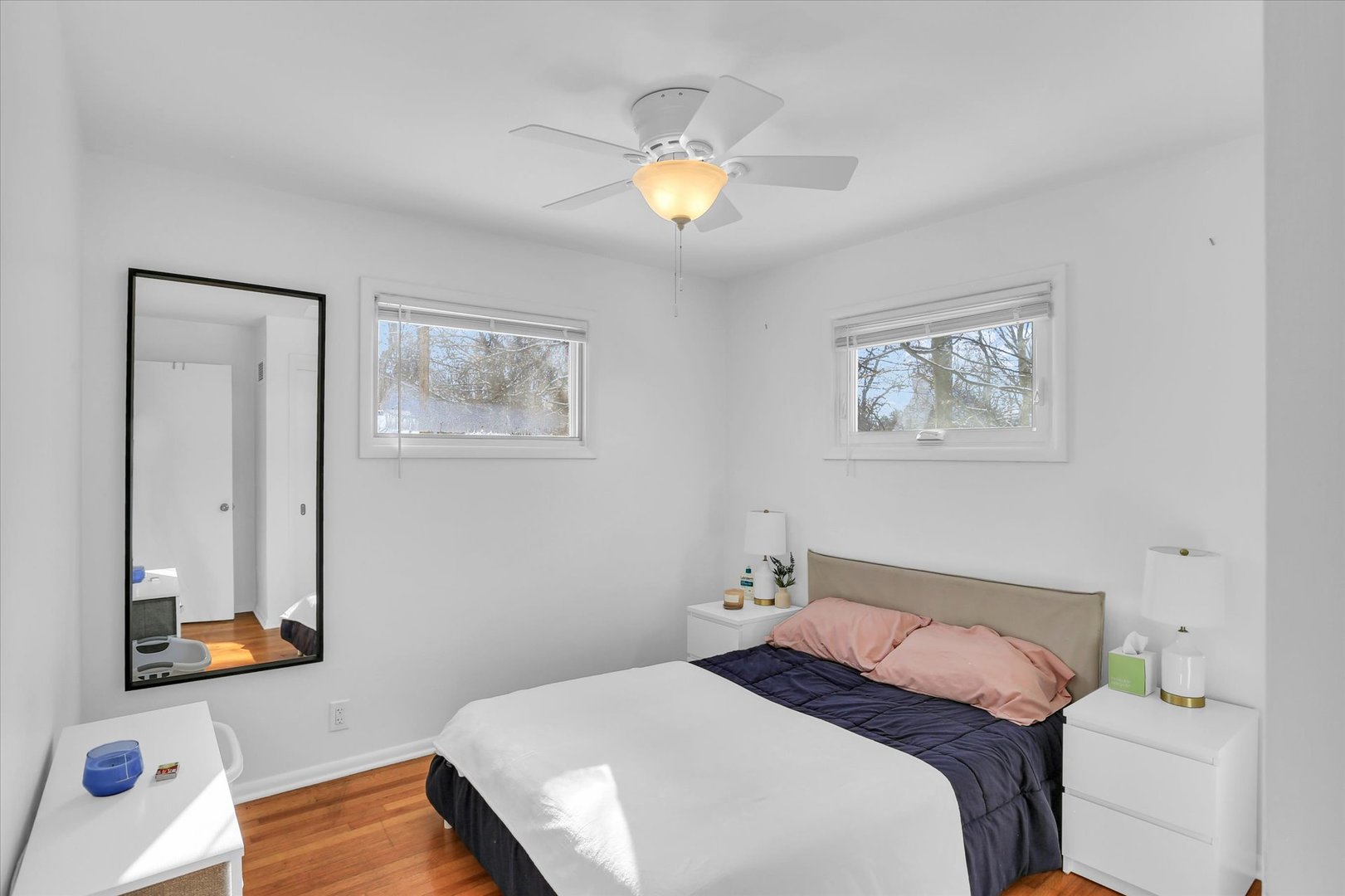 913 West Union Street Champaign, IL 61821 - Photo 16 of 32 a bedroom with a bed and a chandelier