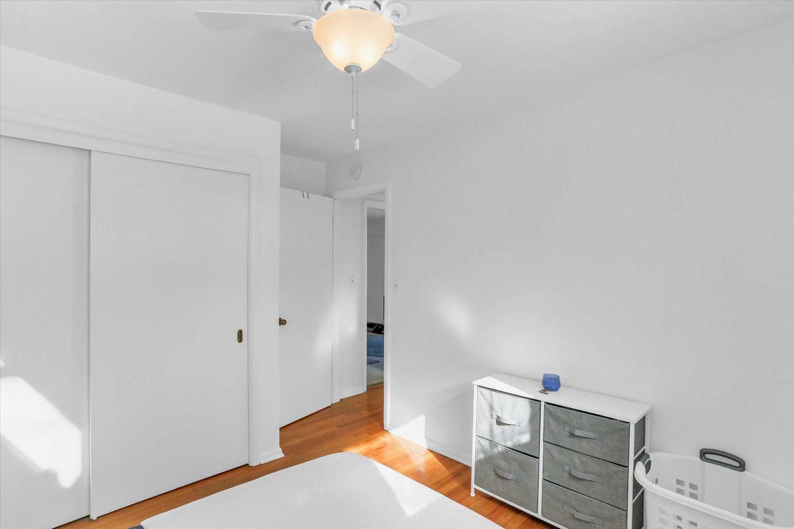 913 West Union Street Champaign, IL 61821 - Photo 17 of 32 a bedroom with a bed and a chandelier