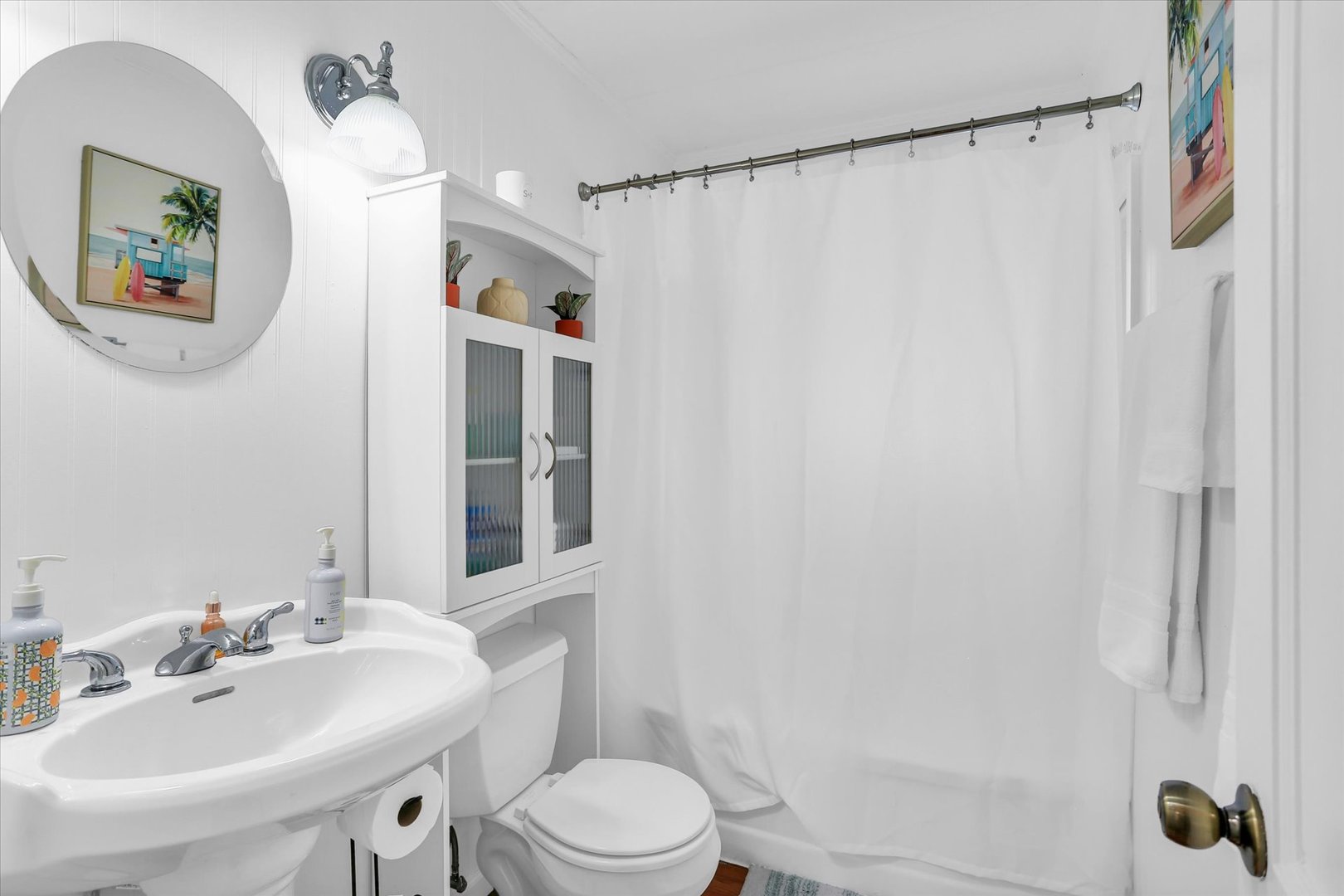 913 West Union Street Champaign, IL 61821 - Photo 18 of 32 a bathroom with a sink vanity mirror and toilet