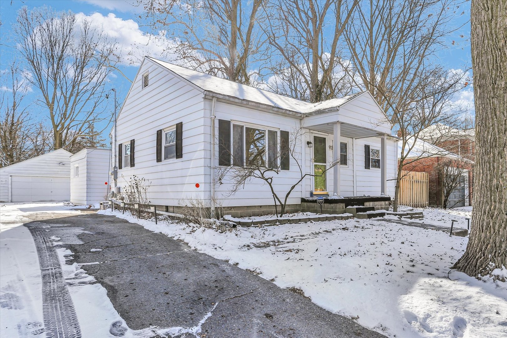 913 West Union Street Champaign, IL 61821 - Photo 2 of 32 a view of a house with a snow on the road