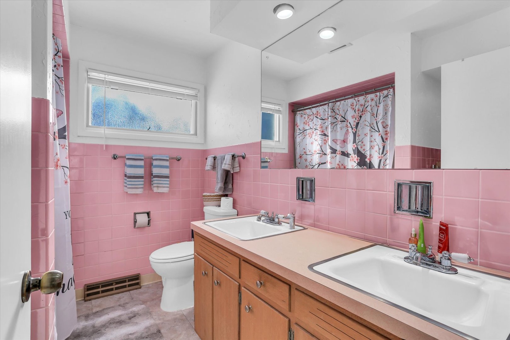 913 West Union Street Champaign, IL 61821 - Photo 23 of 32 a bathroom with a sink vanity mirror and toilet