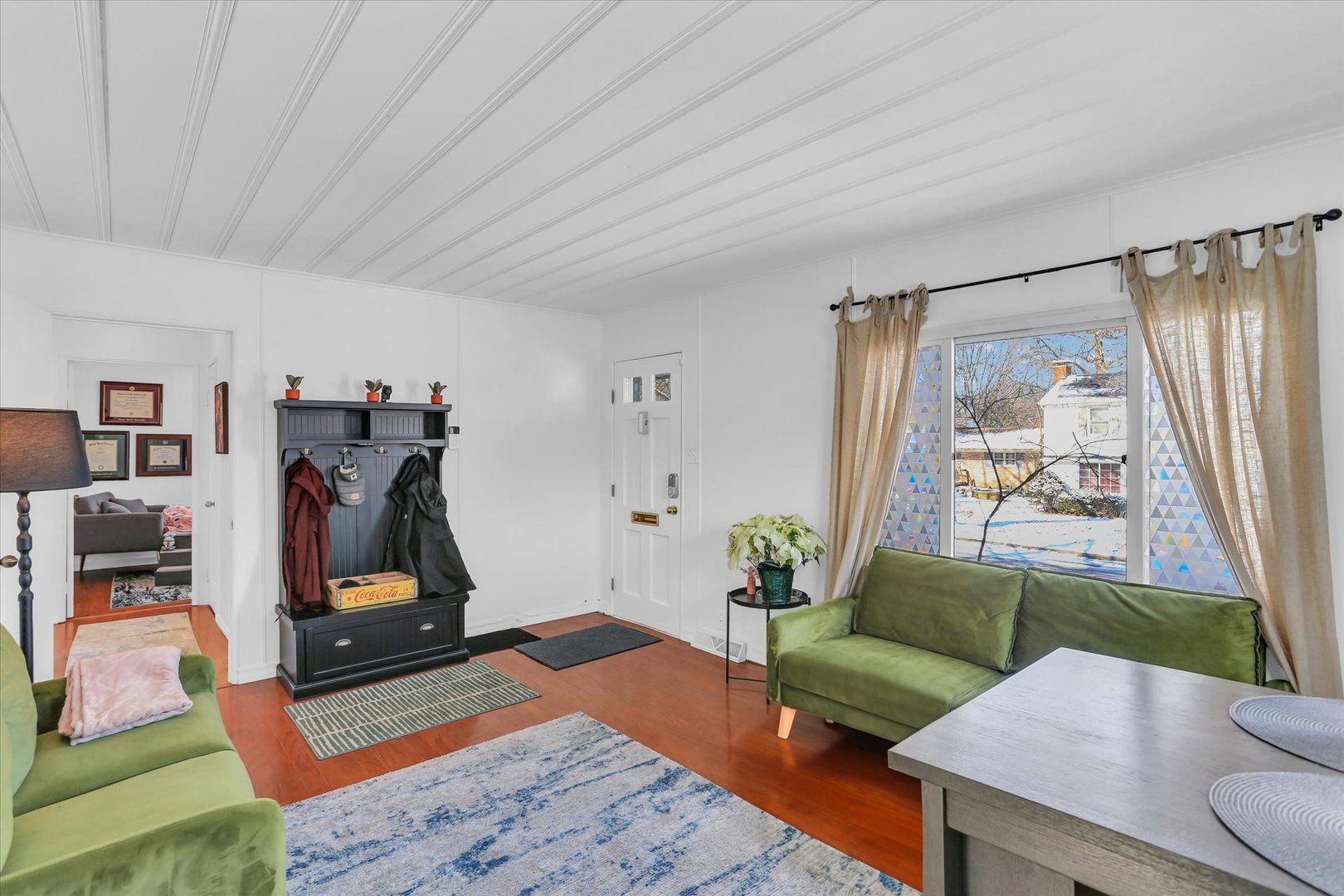 913 West Union Street Champaign, IL 61821 - Photo 5 of 32 a living room with furniture and a flat screen tv