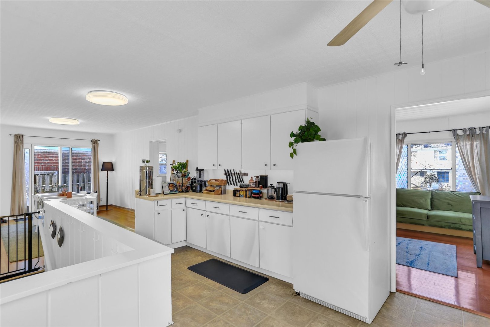 913 West Union Street Champaign, IL 61821 - Photo 9 of 32 a kitchen with white cabinets and white appliances