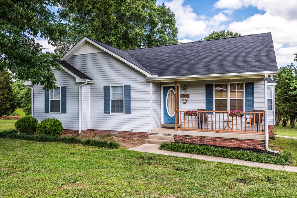 931 Hargrove Road West Dickson, TN 37055 - Photo 1 of 23 a house view with a garden space