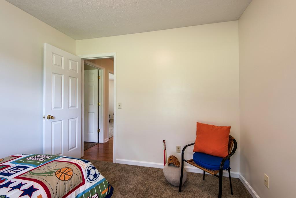 931 Hargrove Road West Dickson, TN 37055 - Photo 15 of 23 a bedroom with a bed and a chair in it