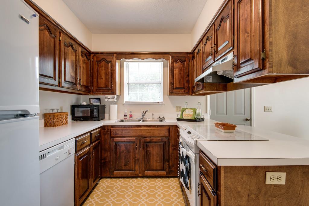 931 Hargrove Road West Dickson, TN 37055 - Photo 7 of 23 a kitchen with a sink a stove and cabinets