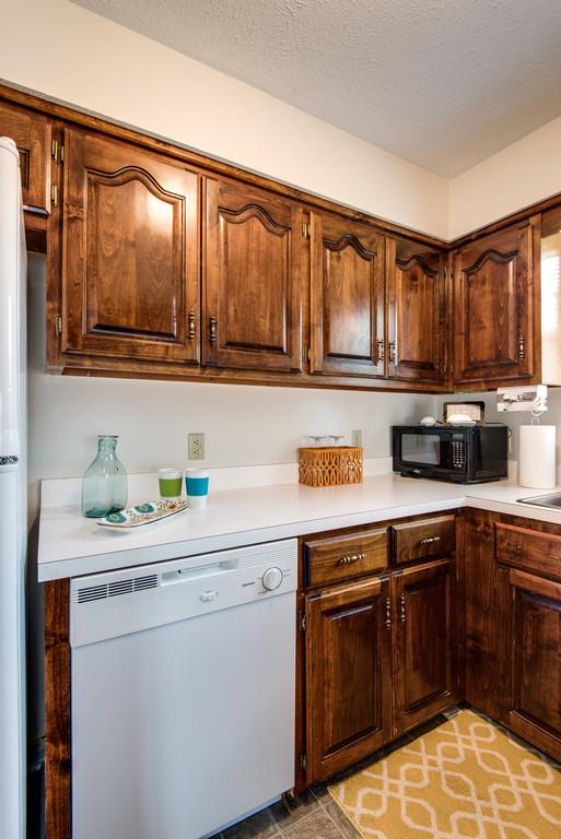 931 Hargrove Road West Dickson, TN 37055 - Photo 9 of 23 a kitchen with a sink stove and cabinets