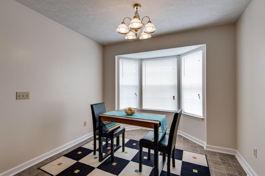 931 Hargrove Road West Dickson, TN 37055 - Photo 10 of 23 a dining room with chandelier and wooden floor