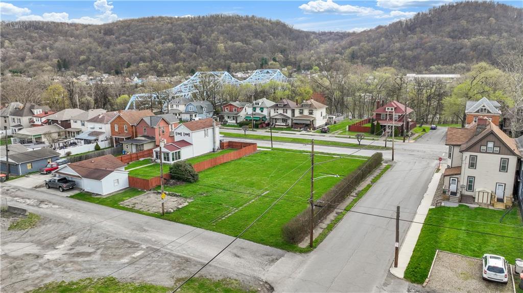 2503 7th Avenue Beaver Falls, PA 15010 - Photo 11 of 22 an aerial view of a house with a garden and lake view