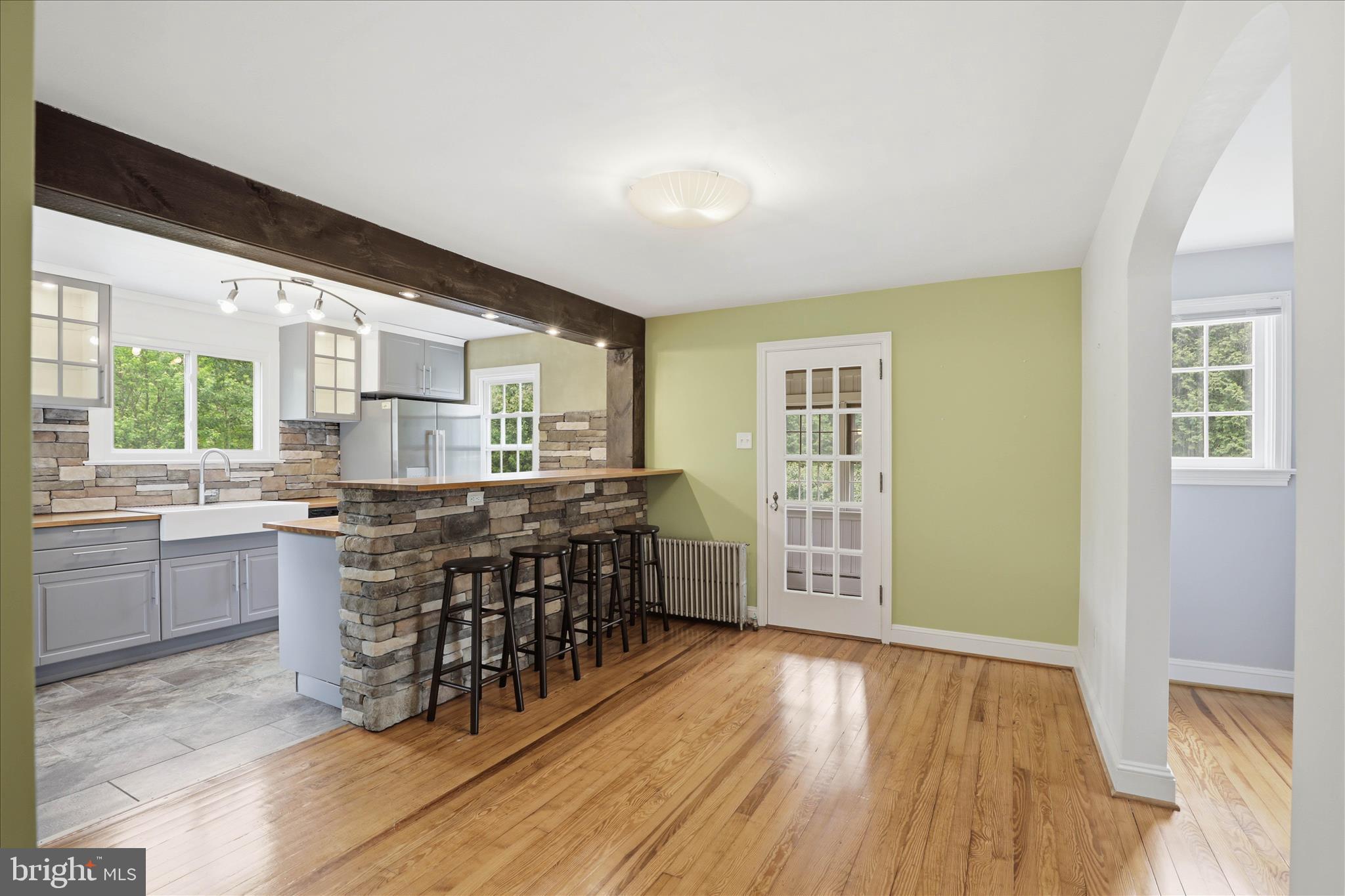 169 School House Road Lancaster, PA 17603 - Photo 9 of 39 a kitchen with stainless steel appliances a kitchen island hardwood floor and a sink