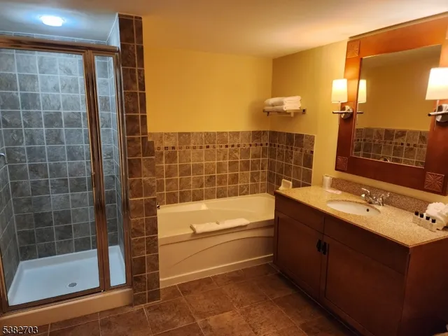 a view of a livingroom with furniture window and wooden floor