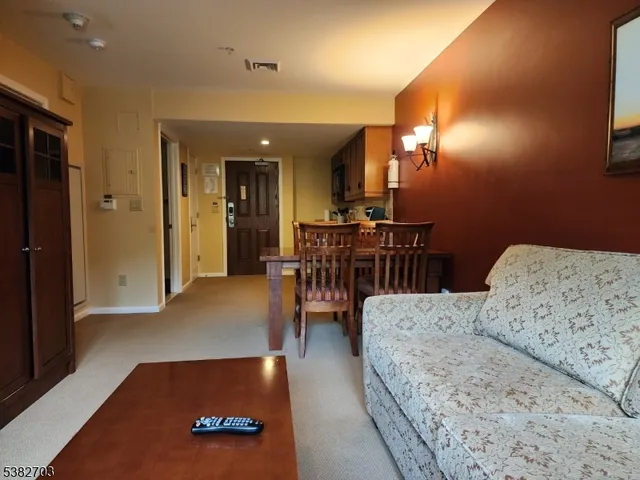 a view of a livingroom with furniture and a flat screen tv