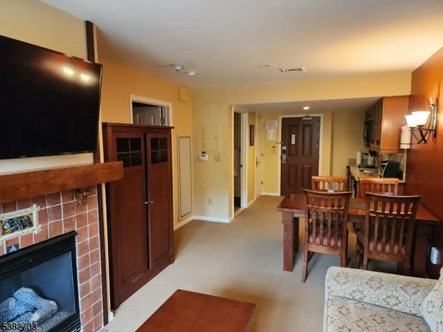 a view of a livingroom with furniture and a ceiling fan