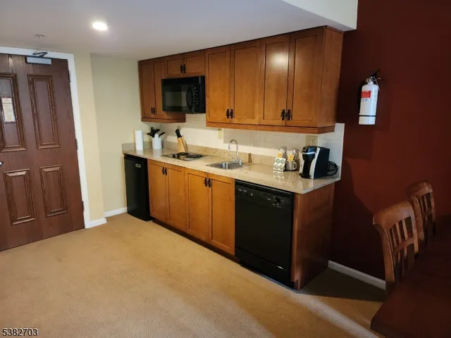 a bedroom with a bed and a lamp on table
