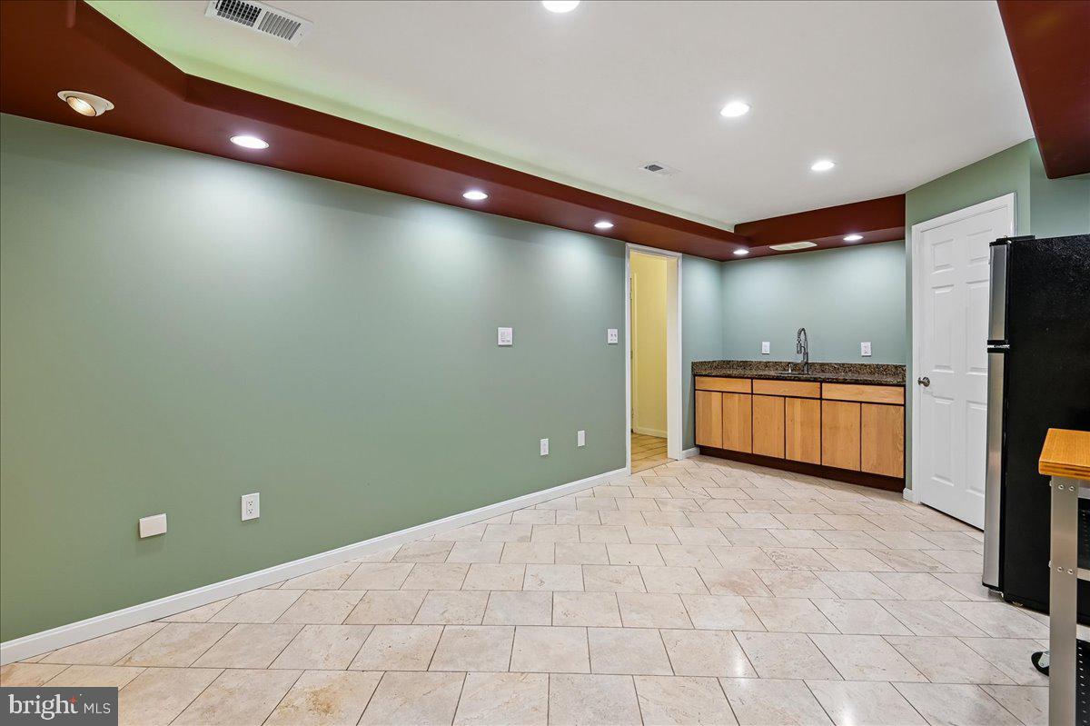 3633 Patuxent River Road Davidsonville, MD 21035 - Photo 54 of 85 Rec. Room w/Travertine Tile Floor & Tray Ceilng
