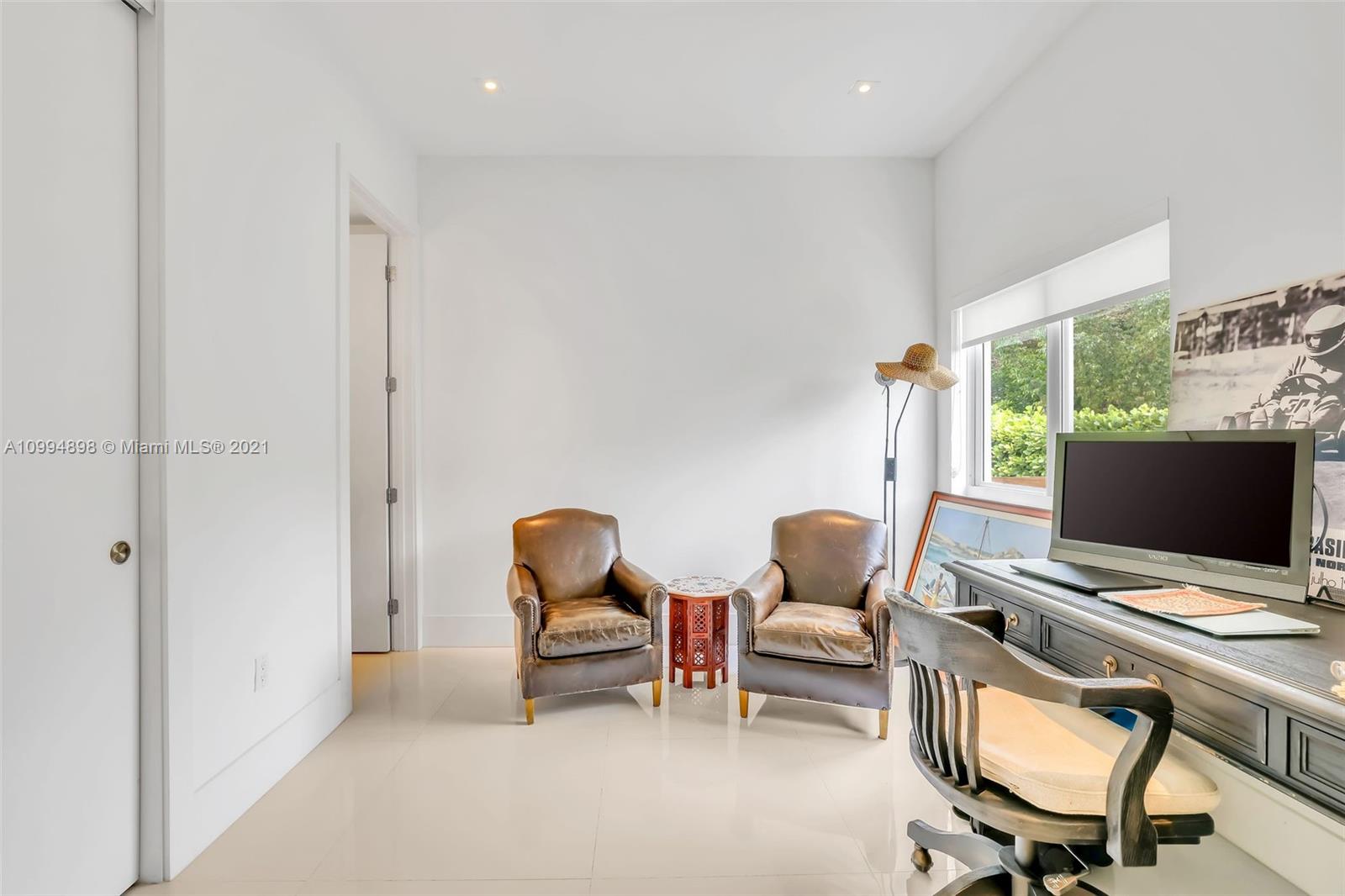 12565 Palm Road North Miami, FL 33181 - Photo 32 of 75 a workspace with furniture and a window