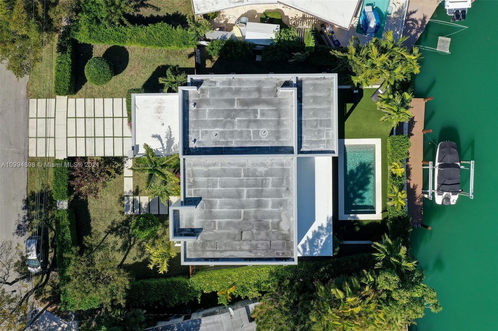 12565 Palm Road North Miami, FL 33181 - Photo 4 of 75 an aerial view of a house with a yard