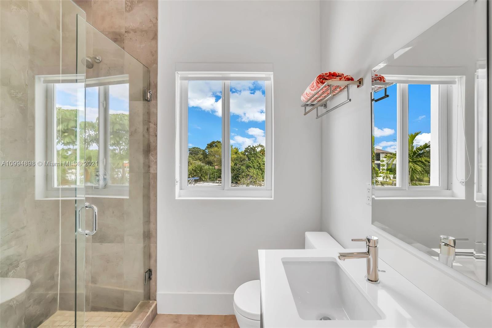 12565 Palm Road North Miami, FL 33181 - Photo 50 of 75 a bathroom with a sink toilet and shower