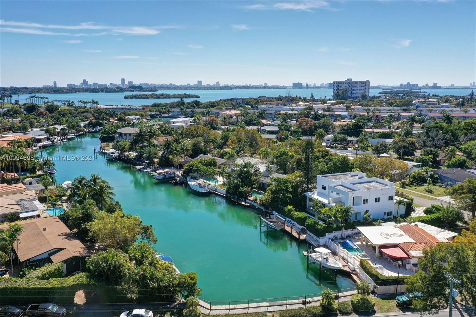 12565 Palm Road North Miami, FL 33181 - Photo 54 of 75 an aerial view of residential houses with outdoor space and lake view