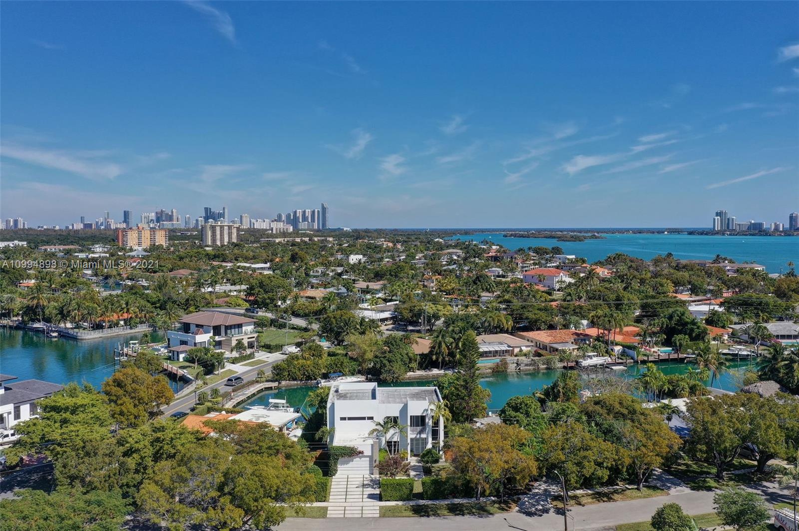 12565 Palm Road North Miami, FL 33181 - Photo 56 of 75 an aerial view of a city with lots of residential buildings lake and ocean view