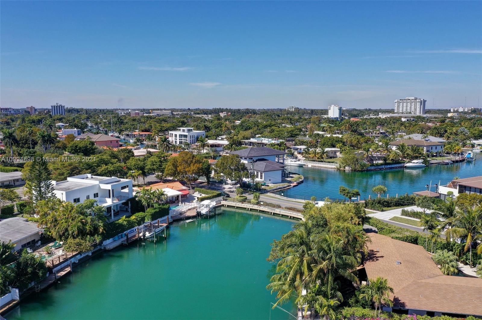 12565 Palm Road North Miami, FL 33181 - Photo 59 of 75 an aerial view of city lake and houses with outdoor space