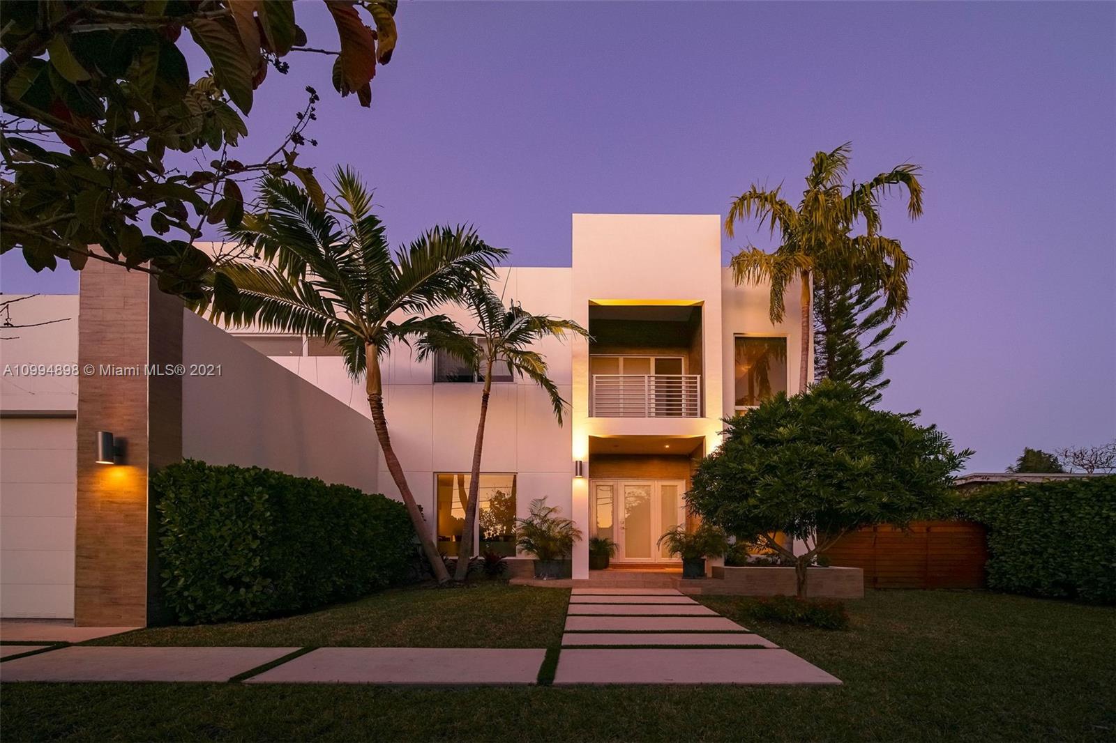 12565 Palm Road North Miami, FL 33181 - Photo 63 of 75 a front view of a house with a garden