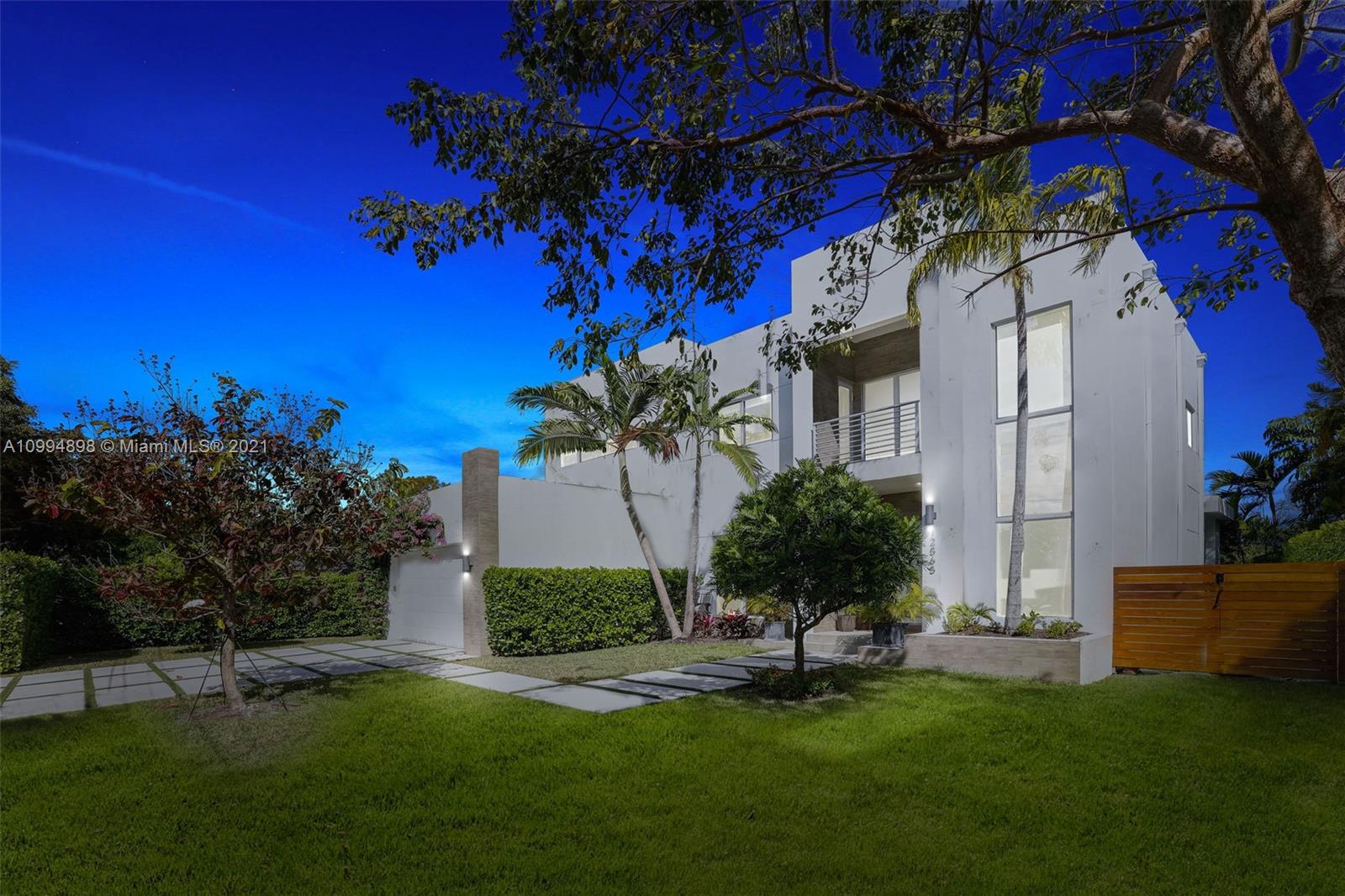 12565 Palm Road North Miami, FL 33181 - Photo 68 of 75 a view of a house with a yard