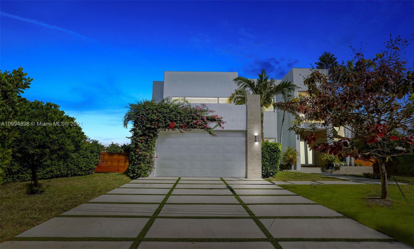 12565 Palm Road North Miami, FL 33181 - Photo 69 of 75 a front view of a house with a yard