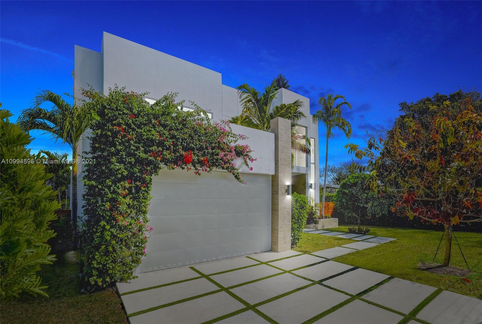 12565 Palm Road North Miami, FL 33181 - Photo 70 of 75 a house with trees in front of it